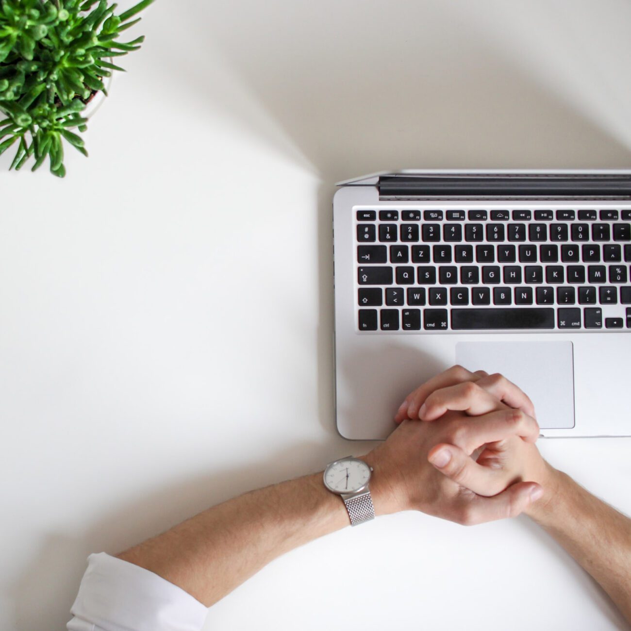HR Burnout - hands folded at a desk