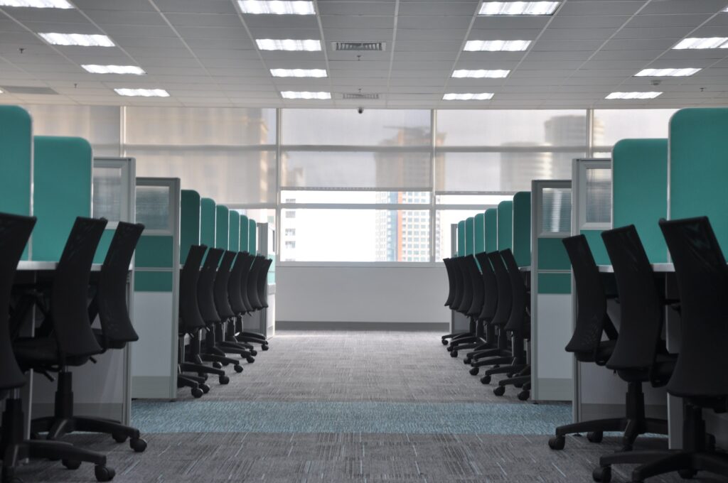 hr burnout - a row of empty desk cubicles 