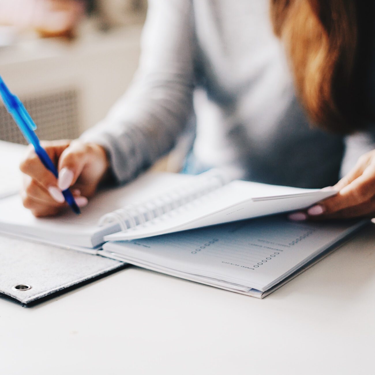 HR burnout - hands writing in a notebook